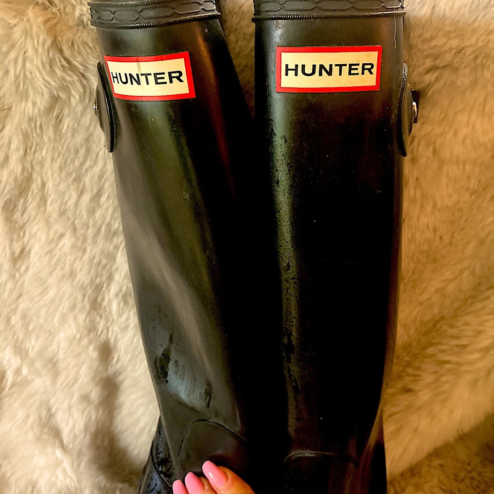 Never been worn knee-high hunter black shiny rain boots with buckle on side